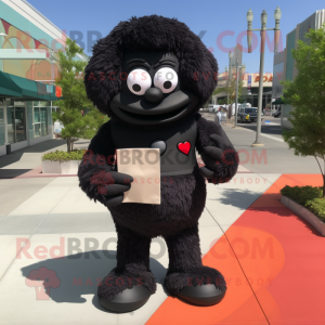 Black Love Letter mascot costume character dressed with a Shorts and Foot pads