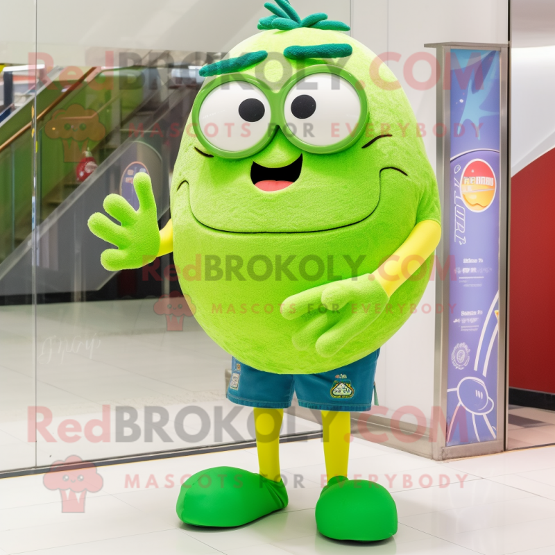 Lime Green Handball Ball mascot costume character dressed with a Denim Shorts and Reading glasses Lime Green Handball Ball mascot costume character dressed with a Denim Shorts and Reading glasses