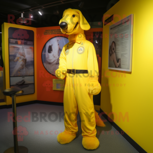 Yellow Dog mascot costume character dressed with a Jumpsuit and Belts