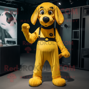 Yellow Dog mascot costume character dressed with a Jumpsuit and Belts