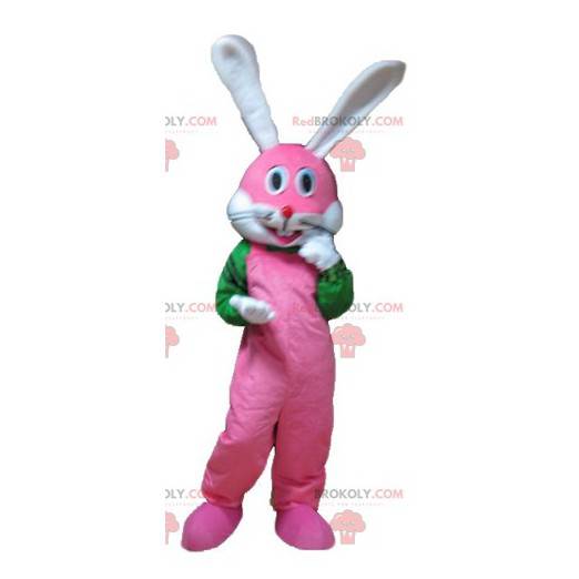 Mascotte de lapin rose blanc et vert très souriant -