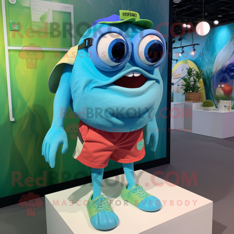 Cyan Piranha mascot costume character dressed with a Shorts and Eyeglasses Cyan Piranha mascot costume character dressed with a Shorts and Eyeglasses