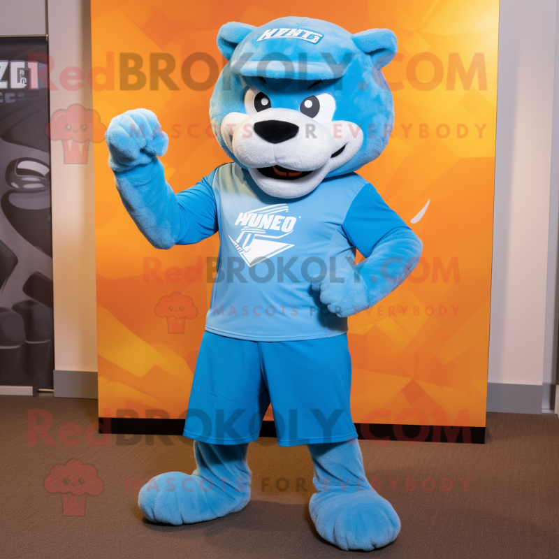 Sky Blue Puma mascot costume character dressed with a Graphic Tee and Caps Sky Blue Puma mascot costume character dressed with a Graphic Tee and Caps