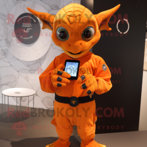 Orange Gargoyle mascot costume character dressed with a Long Sleeve Tee and Smartwatches