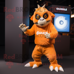 Orange Gargoyle mascot costume character dressed with a Long Sleeve Tee and Smartwatches