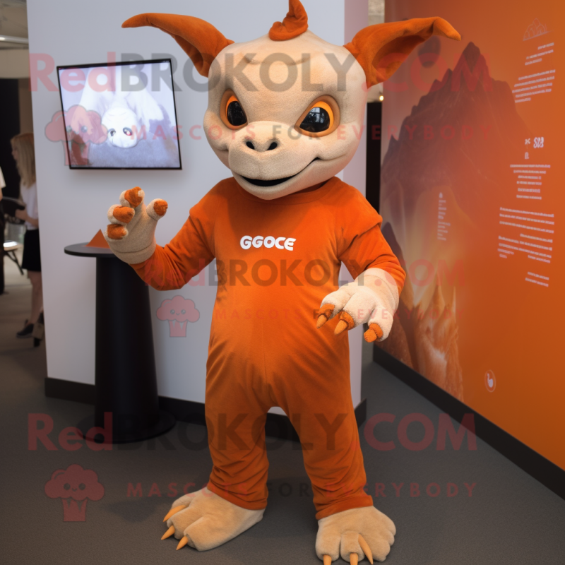 Orange Gargoyle mascot costume character dressed with a Long Sleeve Tee and Smartwatches