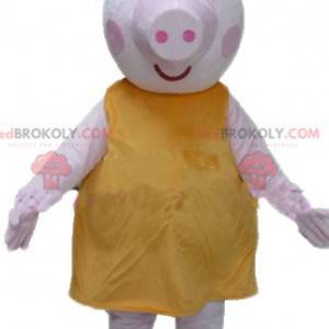 Mascot gran cerdo rosa con un vestido amarillo regordete y