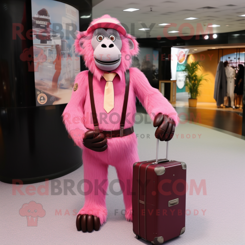 Pink Baboon mascot costume character dressed with a Suit and Messenger bags Pink Baboon mascot costume character dressed with a Suit and Messenger bags
