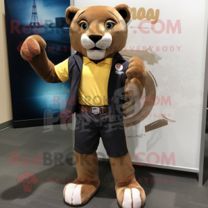 Brown Mountain Lion mascot costume character dressed with a Board Shorts and Lapel pins