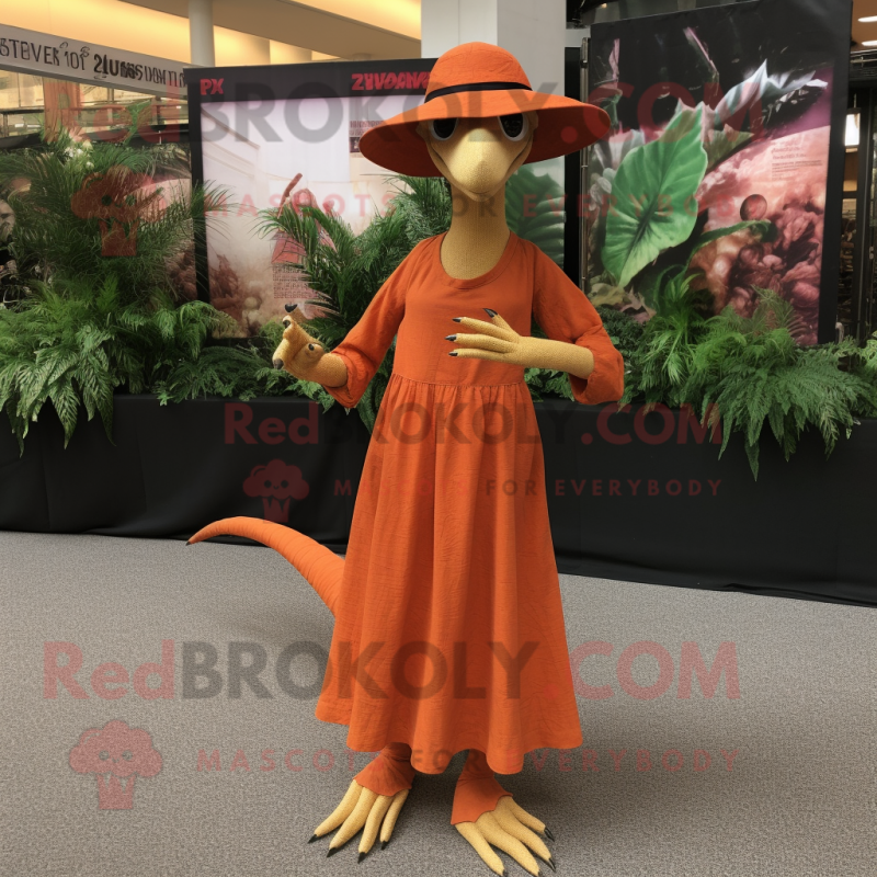 Orange Coelophysis mascot costume character dressed with a Maxi Dress and Hats Orange Coelophysis mascot costume character dressed with a Maxi Dress and Hats