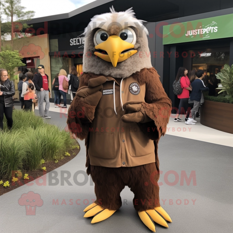 Brown Haast'S Eagle mascot costume character dressed with a Hoodie and Keychains Brown Haast'S Eagle mascot costume character dressed with a Hoodie and Keychains