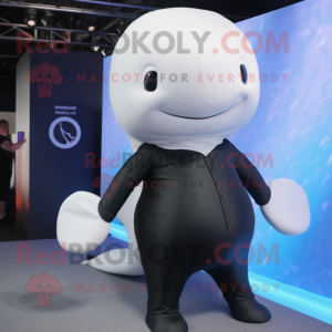 Black Beluga Whale mascot costume character dressed with a Playsuit and Tie pins