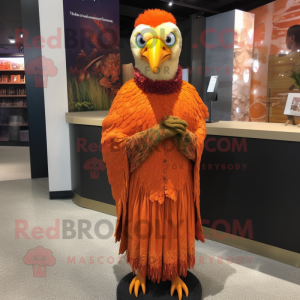 Orange Pheasant mascot costume character dressed with a Pencil Skirt and Shawl pins