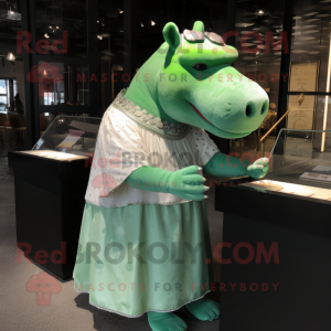 Green Hippopotamus mascot costume character dressed with a Skirt and Shawl pins