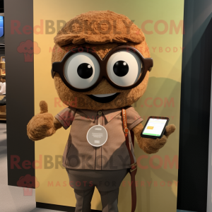 Brown Ramen mascot costume character dressed with a Oxford Shirt and Smartwatches