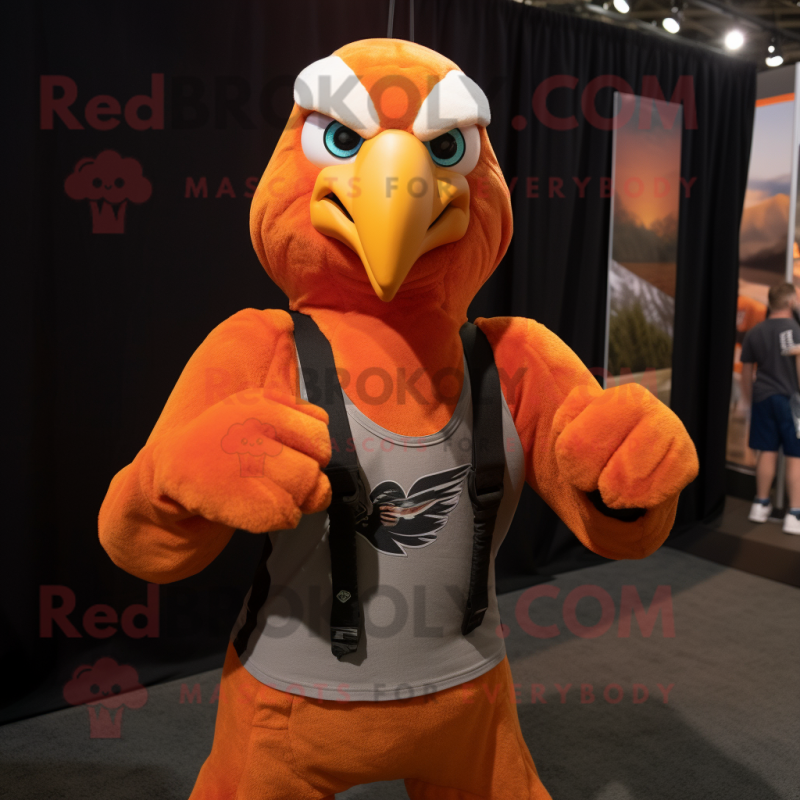 Orange Bald Eagle mascot costume character dressed with a Tank Top and Headbands Orange Bald Eagle mascot costume character dressed with a Tank Top and Headbands
