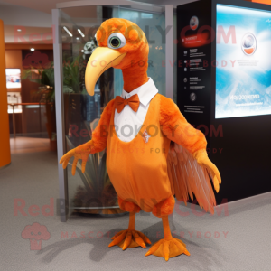 Orange Dodo Bird mascot costume character dressed with a Dress Shirt and Lapel pins