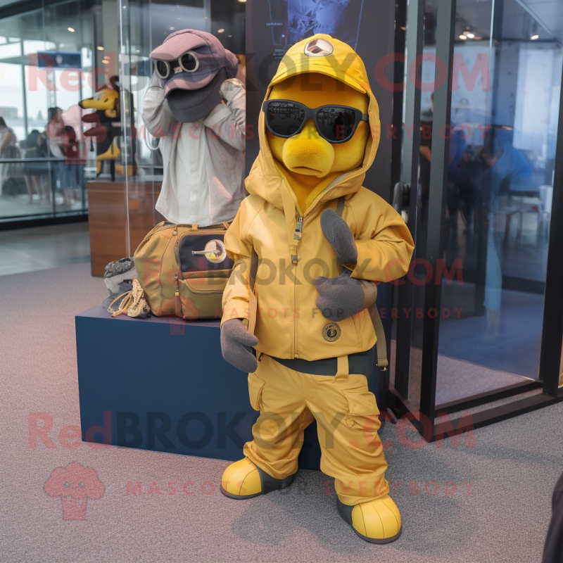 Yellow Navy Seal mascot costume character dressed with a Windbreaker and Handbags Yellow Navy Seal mascot costume character dressed with a Windbreaker and Handbags