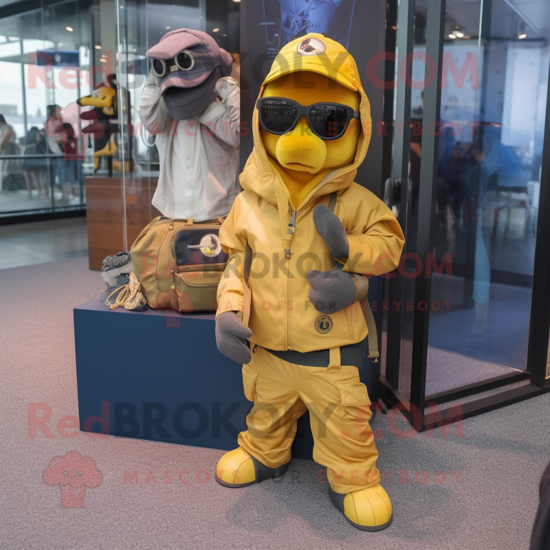 Yellow Navy Seal mascot costume character dressed with a Windbreaker and Handbags