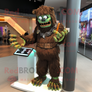 Brown Frankenstein'S Monster mascot costume character dressed with a Long Sleeve Tee and Bracelet watches