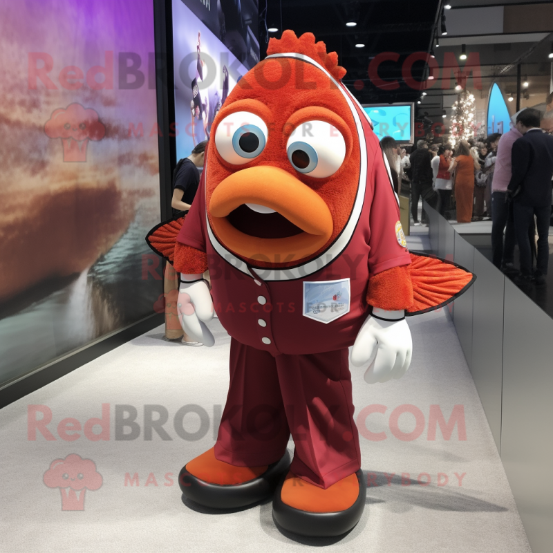 Maroon Clown Fish mascot costume character dressed with a Polo Shirt and Tie pins Maroon Clown Fish mascot costume character dressed with a Polo Shirt and Tie pins