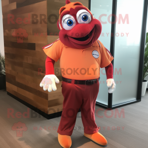 Maroon Clown Fish mascot costume character dressed with a Polo Shirt and Tie pins