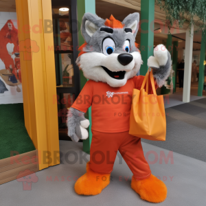 Orange Say Wolf mascot costume character dressed with a Trousers and Tote bags