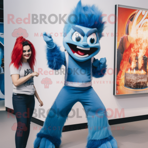 Blue Fire Eater mascot costume character dressed with a Flare Jeans and Watches