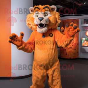 Orange Smilodon mascot costume character dressed with a Playsuit and Suspenders