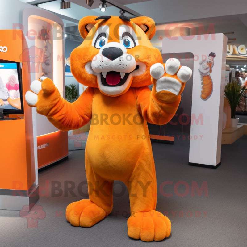 Orange Smilodon mascot costume character dressed with a Playsuit and Suspenders Orange Smilodon mascot costume character dressed with a Playsuit and Suspenders