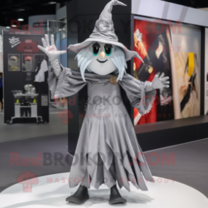 Silver Witch mascot costume character dressed with a Overalls and Scarf clips