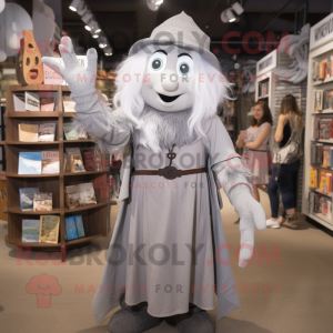 Silver Witch mascot costume character dressed with a Overalls and Scarf clips