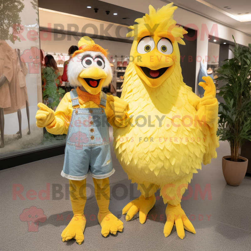 Yellow Rooster mascot costume character dressed with a Mom Jeans and Mittens