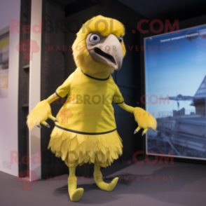Lemon Yellow Vulture mascot costume character dressed with a Running Shorts and Mittens