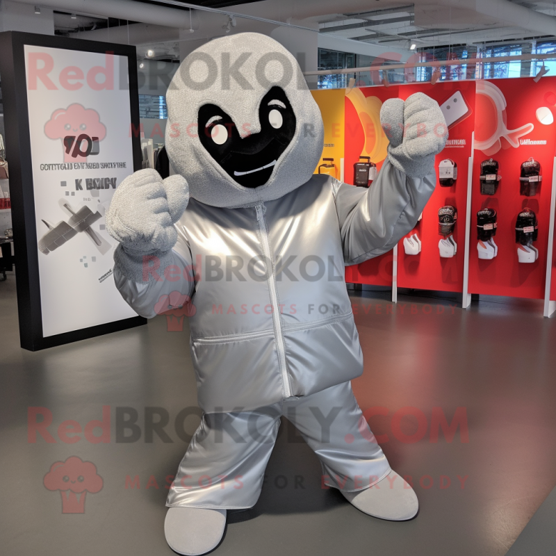 Silver Boxing Glove mascot costume character dressed with a Raincoat and Beanies