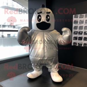 Silver Boxing Glove mascot costume character dressed with a Raincoat and Beanies