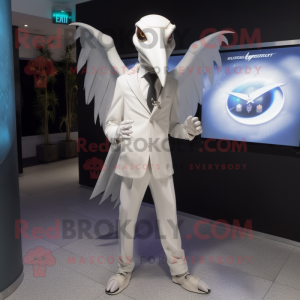 White Pterodactyl mascot costume character dressed with a Suit Pants and Smartwatches