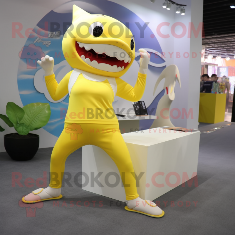 Lemon Yellow Shark mascot costume character dressed with a Yoga Pants and Hair clips