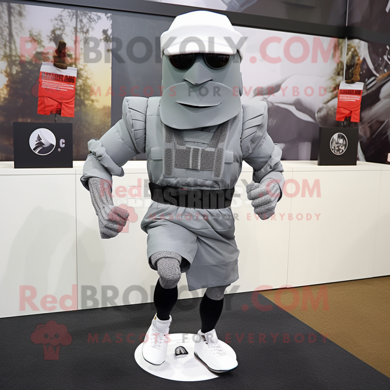 Gray Commando mascot costume character dressed with a Running Shorts and Scarf clips Gray Commando mascot costume character dressed with a Running Shorts and Scarf clips