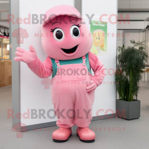 Pink Zucchini mascot costume character dressed with a Dungarees and Mittens