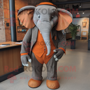 Rust Elephant mascot costume character dressed with a Suit Pants and Tie pins