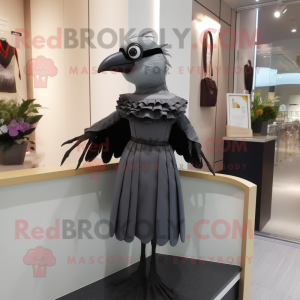 Gray Blackbird mascot costume character dressed with a Sheath Dress and Rings