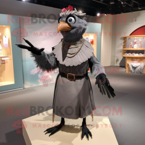 Gray Blackbird mascot costume character dressed with a Sheath Dress and Rings