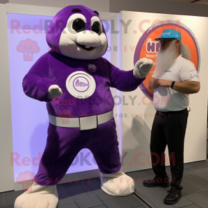 Purple Seal mascot costume character dressed with a Capri Pants and Digital watches