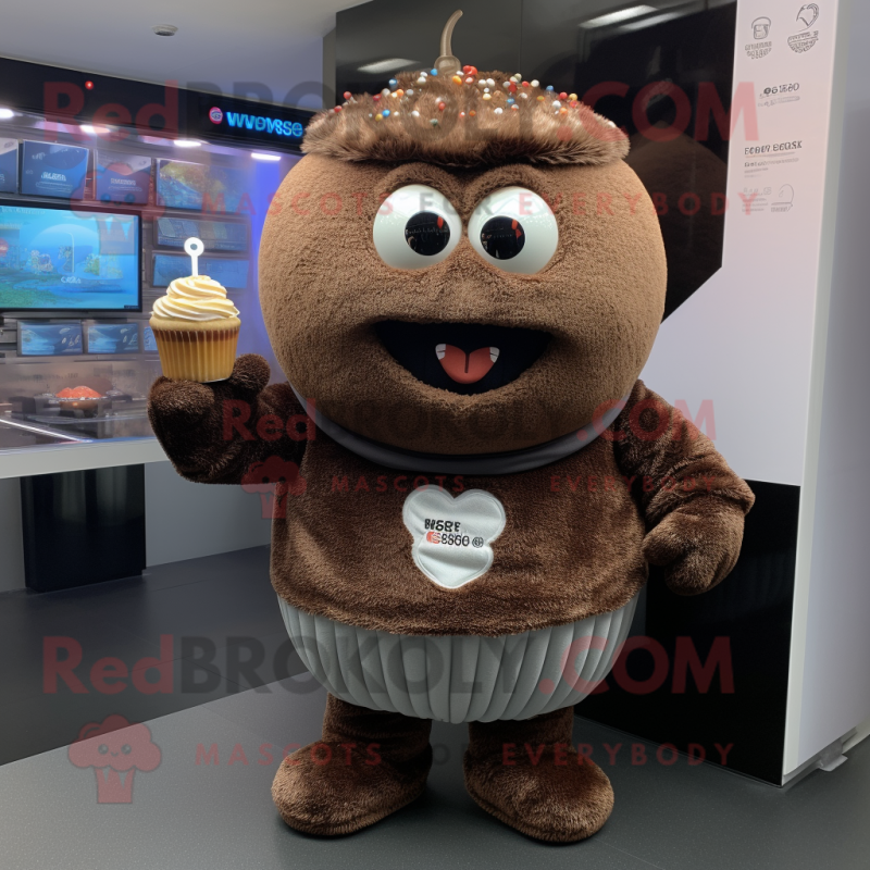 Brown Cupcake mascot costume character dressed with a Sweatshirt and Bracelets Brown Cupcake mascot costume character dressed with a Sweatshirt and Bracelets