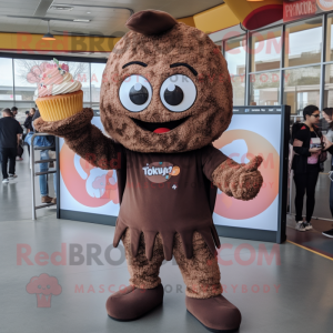 Brown Cupcake mascot costume character dressed with a Sweatshirt and Bracelets
