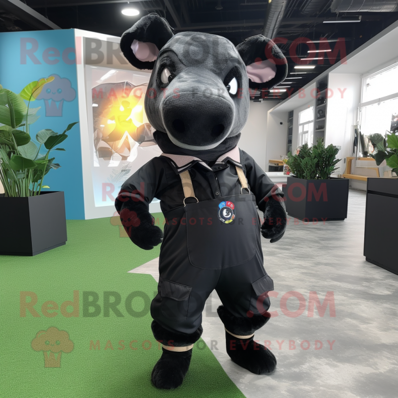 Black Tapir mascot costume character dressed with a Overalls and Ties