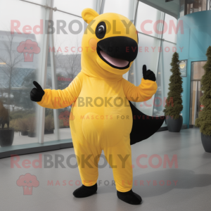 Yellow Killer Whale mascot costume character dressed with a Yoga Pants and Mittens