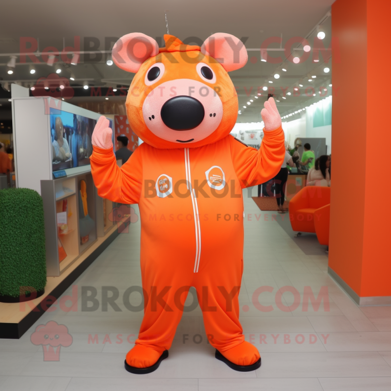 Orange Pig mascot costume character dressed with a Jumpsuit and Shoe laces