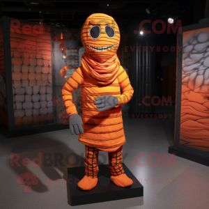 Orange Mummy mascot costume character dressed with a Flannel Shirt and Foot pads